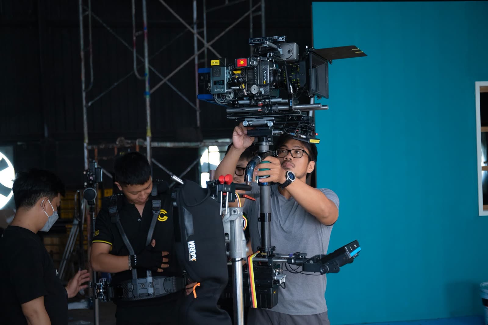 Camera operator with a cinema camera on a studio set